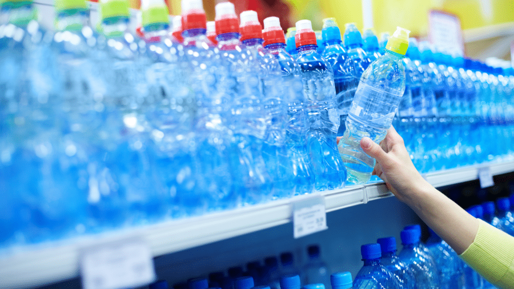 mineral water bottles in a store aisle